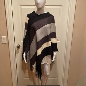 Black, grey, cream striped fringe poncho.